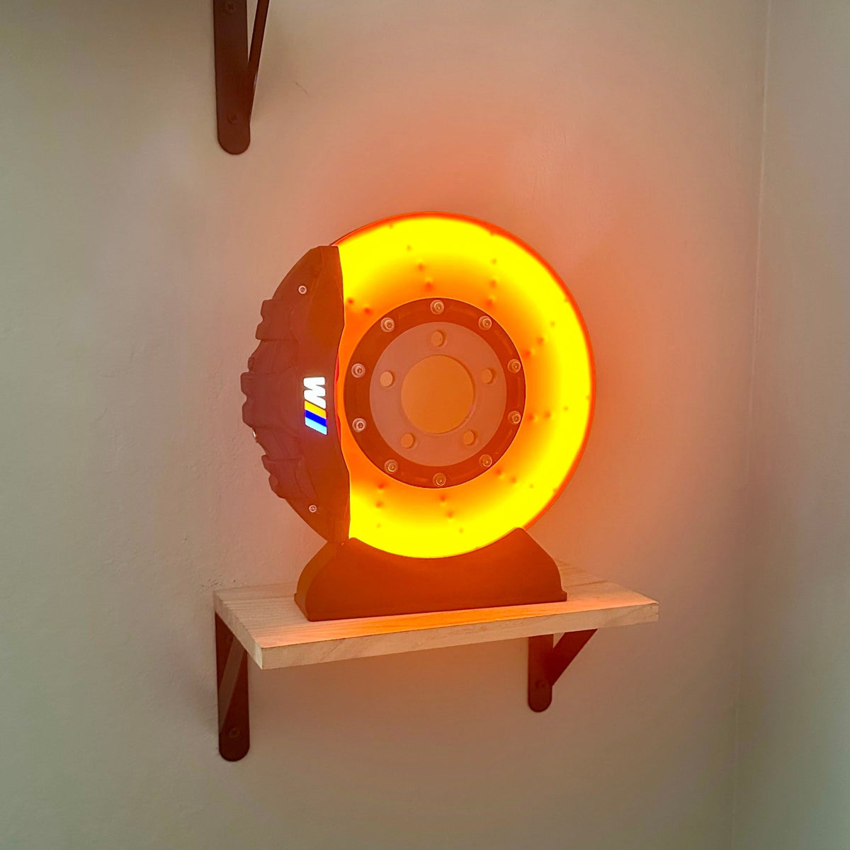 Performance brake disc display on desk — motorsport-inspired LED lamp