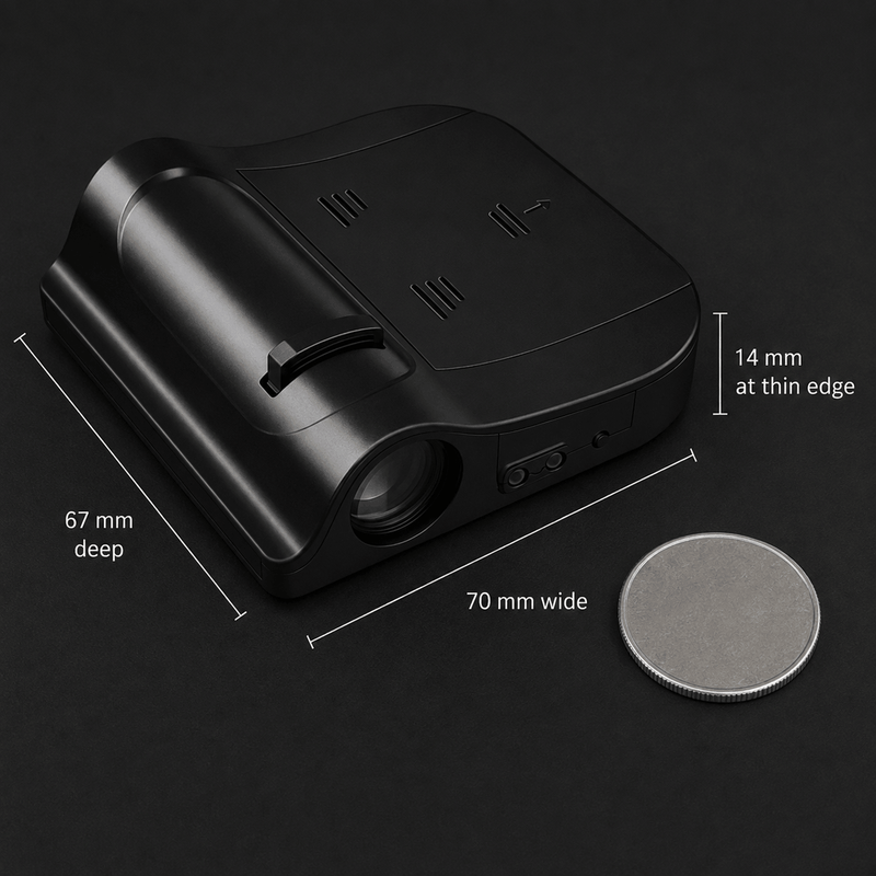 The projector beside a coin for scale, marked 70 mm wide, 67 mm deep and 14 mm at its thin edge