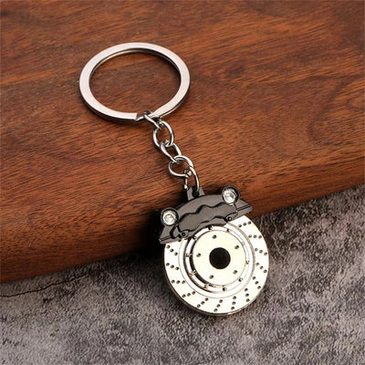 JDM brake rotor keychain — drilled and slotted disc with reinforced keyring loop