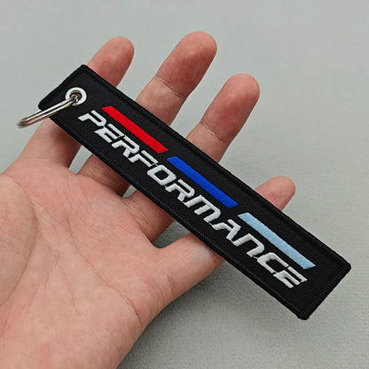 Performance lanyard clipped to keys — daily carry size
