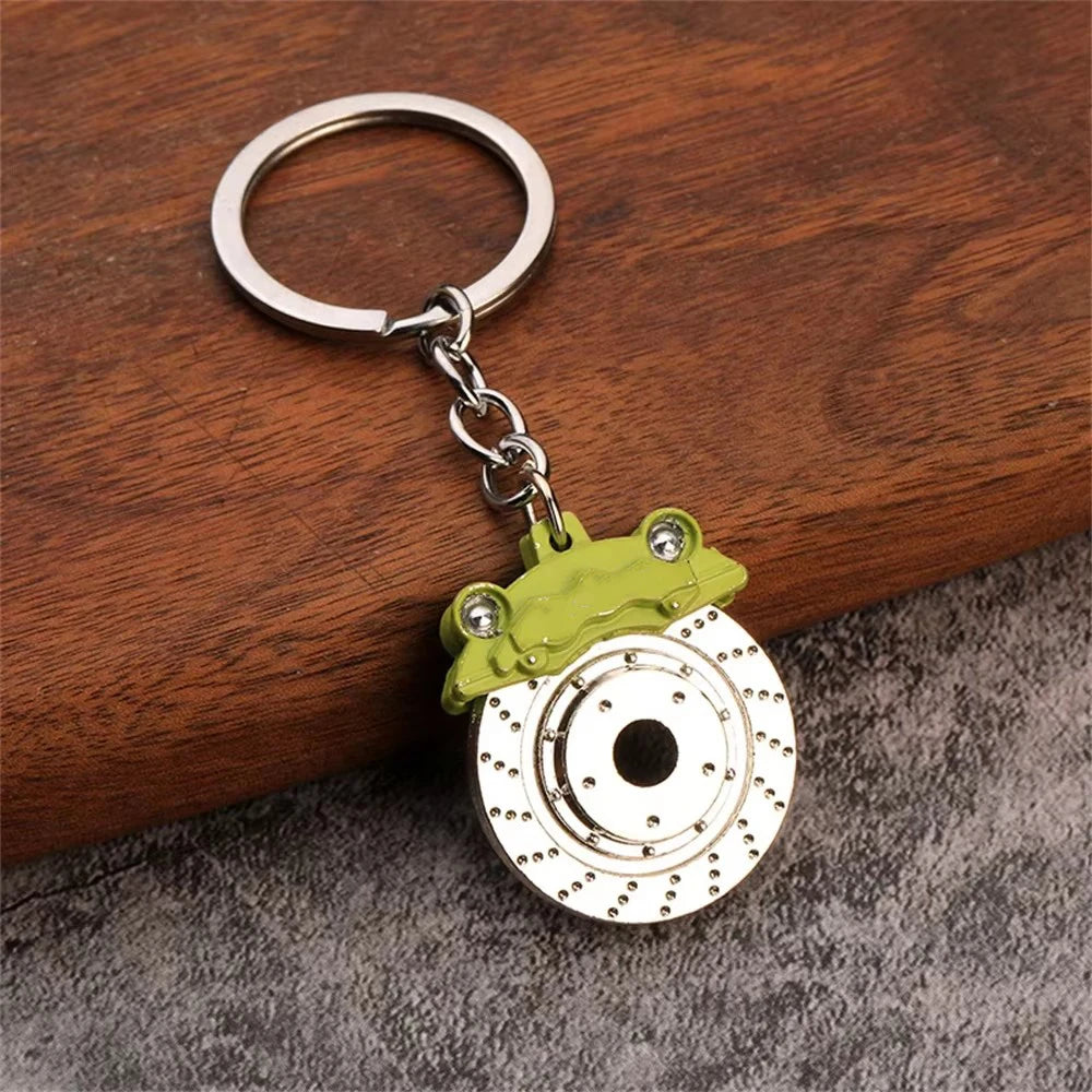 Brake disc keychain close-up — heavy zinc alloy build